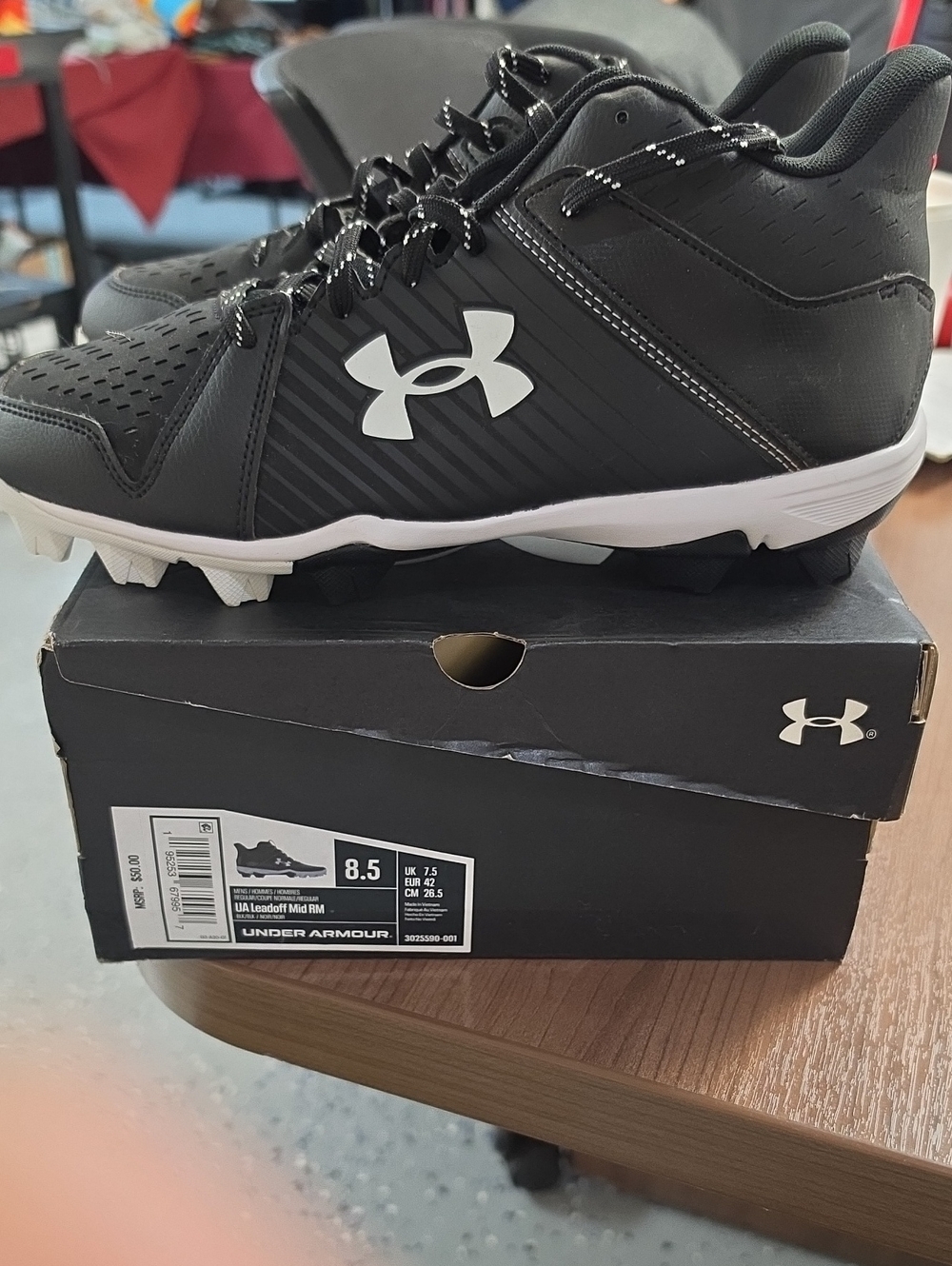 Under Armour Black and White Kids Athletic Cleats